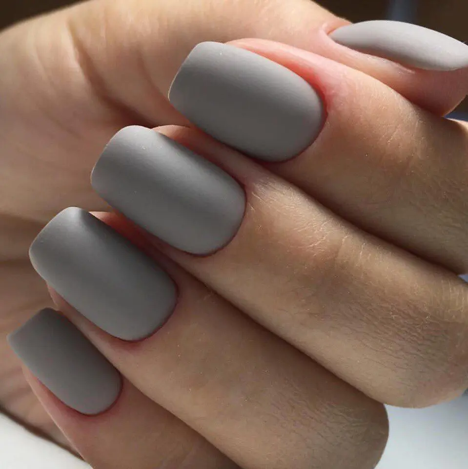 Matte gray nails with single gem accent